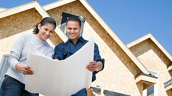 Couple with home building plans